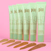 Pixi H2O Skintint tubes on a pink background view of medium shades