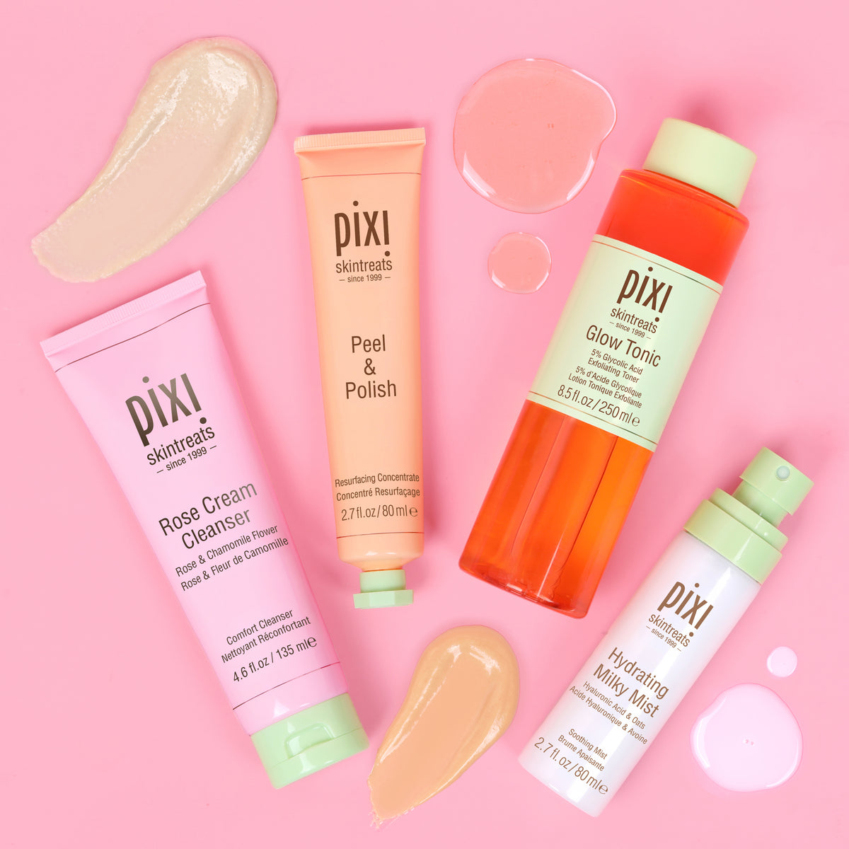 Pixi Glow Starter Routine skincare set arranged on a solid pink background: Rose Cream Cleanser in a pink tube, Peel & Polish in a peach tube, Hydrating Milky Mist in a white bottle with a mint cap, and Glow Tonic in an orange bottle with a pale green cap - top