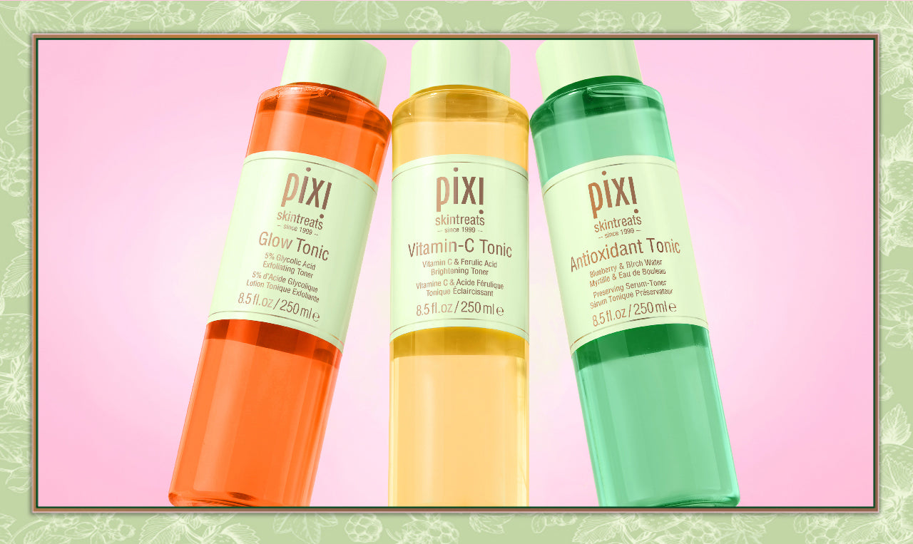 Three Pixi skincare toner bottles in orange, yellow, and green, displayed side-by-side on a pink background with a decorative green border.