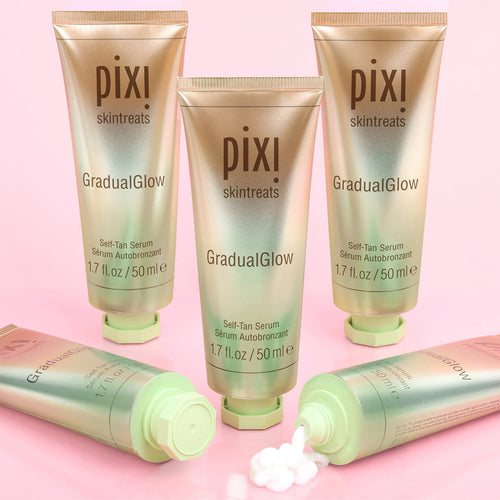 Pixi Gradual Glow self-tan serum tubes on a pink background view 2