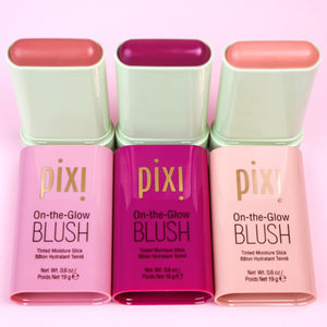 Three PIXI On-the-Glow Blush products on a pink background