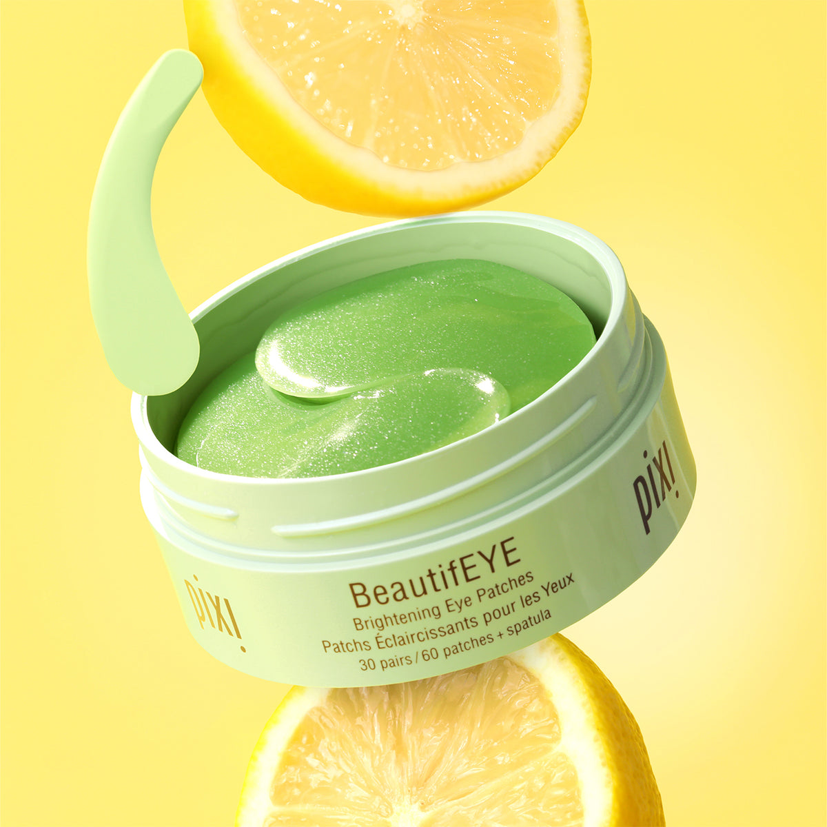 Pixi BeautifEYE eye patches jar with lemon slices on a yellow background