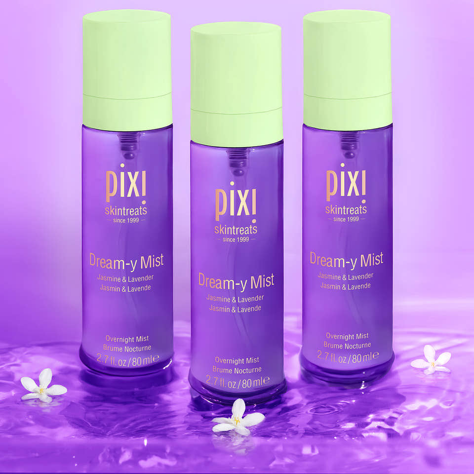 Three bottles of Pixi Dream-y Mist on a purple background view 1