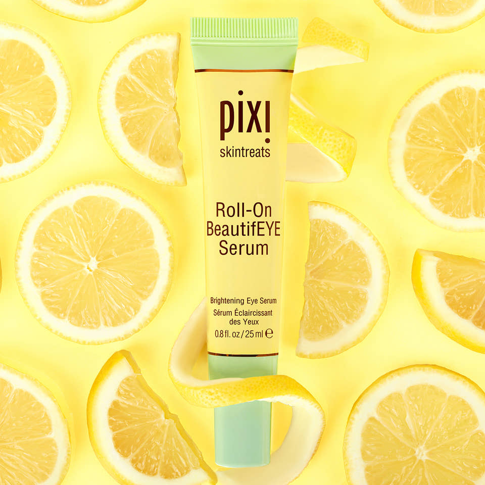 Pixi Roll-On BeautifEYE Serum with lemon slices on a yellow background view 1