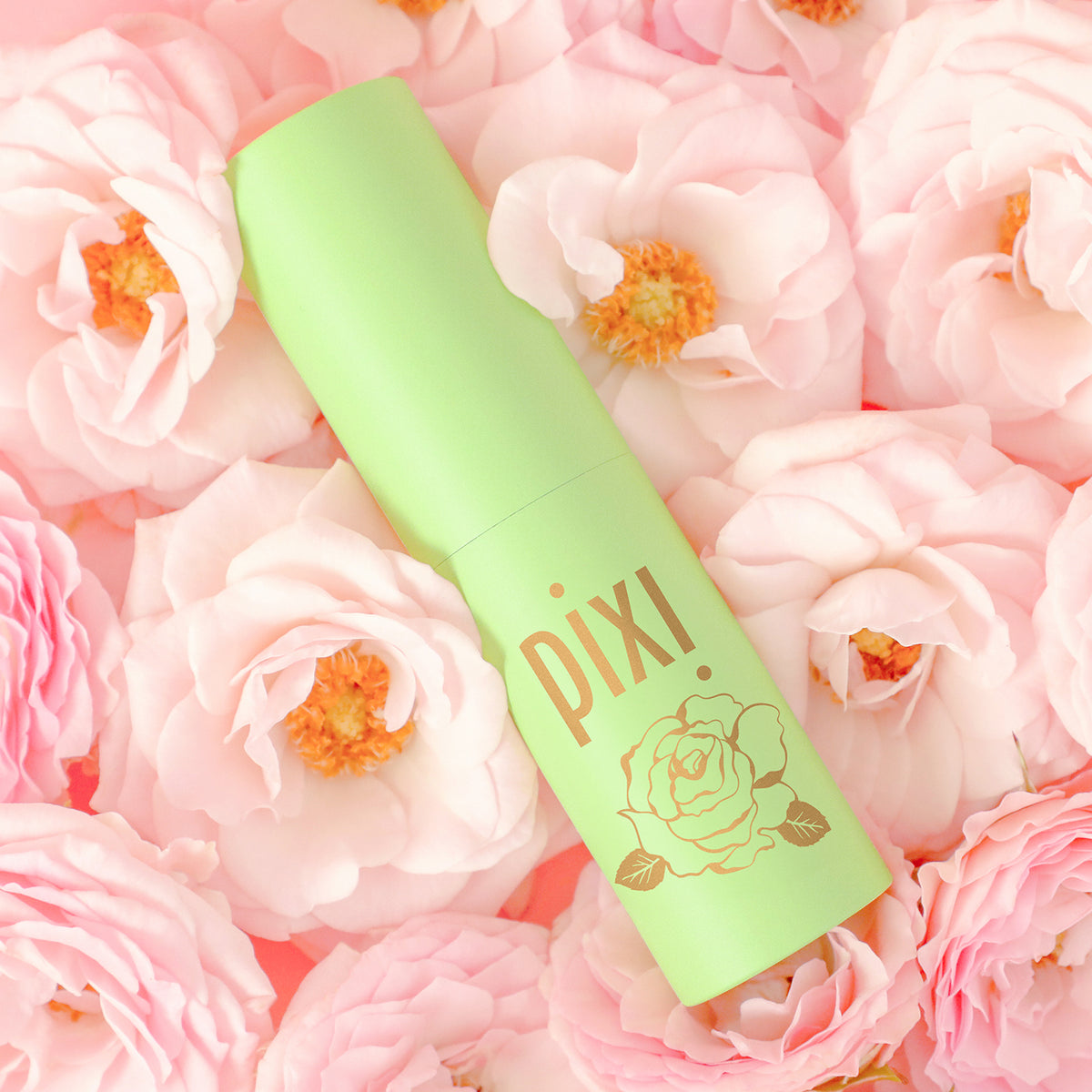 PixiRose Perfume shown on a rose background