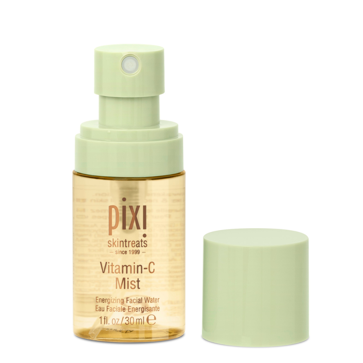 Pixi Skintreats Vitamin-C Mist facial spray bottle with a pale green pump and cap, shown next to its cap on a white background.